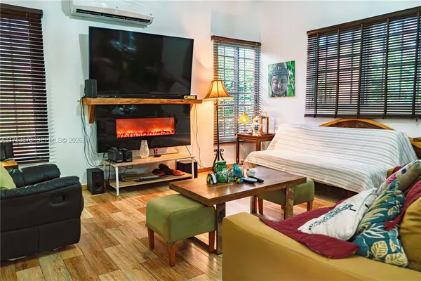 a kitchen with stainless steel appliances granite countertop a stove a sink and a dining table