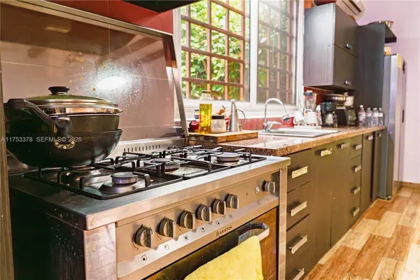 a kitchen with a sink and cabinets