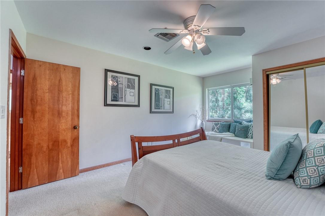 5901 Cypress Road Plantation, FL 33317 - Photo 16 of 99 a bedroom with a large bed and a chandelier