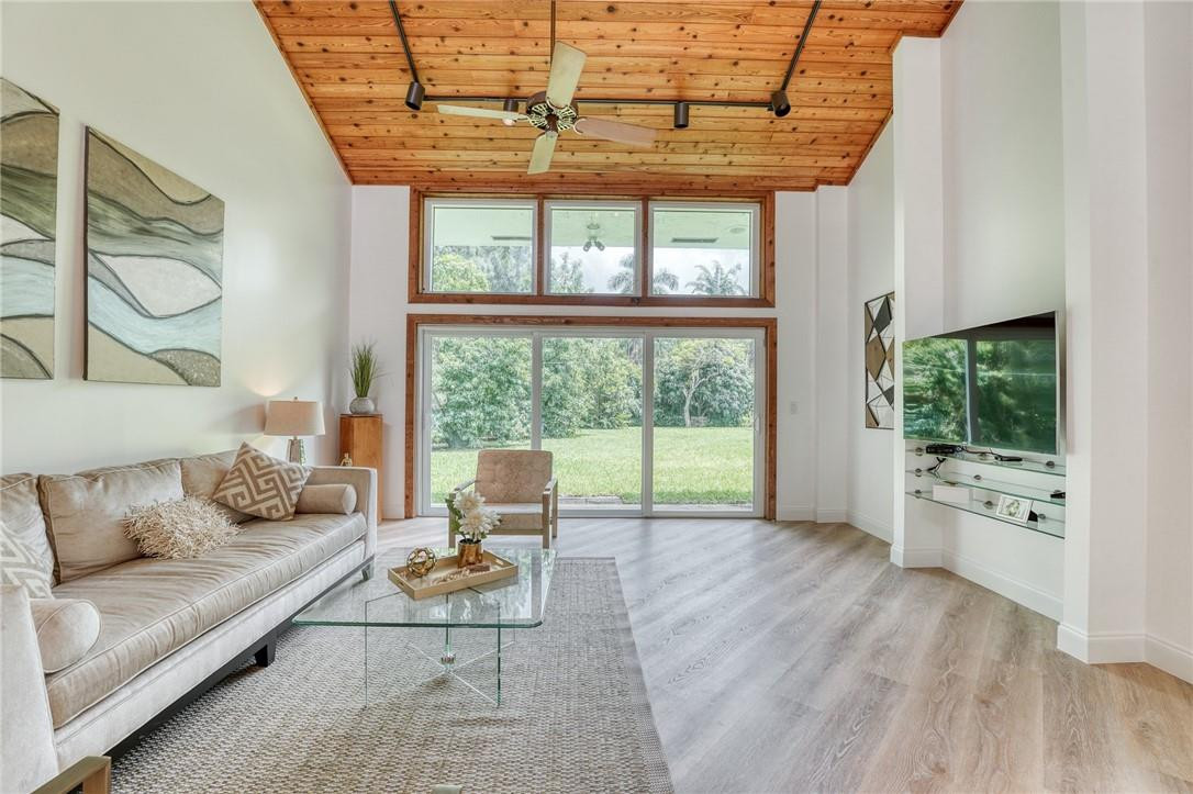 5901 Cypress Road Plantation, FL 33317 - Photo 35 of 99 a living room with furniture and a floor to ceiling window