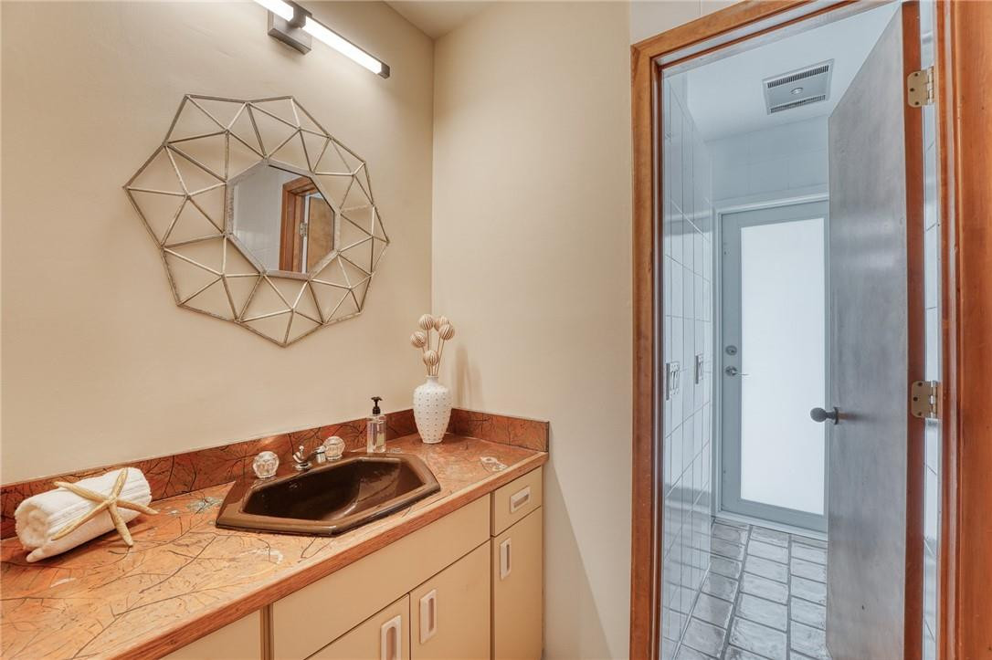 5901 Cypress Road Plantation, FL 33317 - Photo 41 of 99 a bathroom with a sink and a mirror