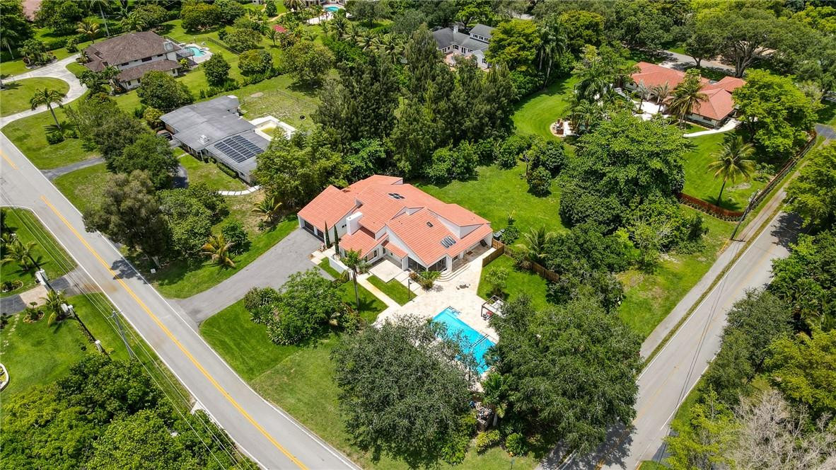 5901 Cypress Road Plantation, FL 33317 - Photo 5 of 99 an aerial view of a house with a yard and outdoor seating