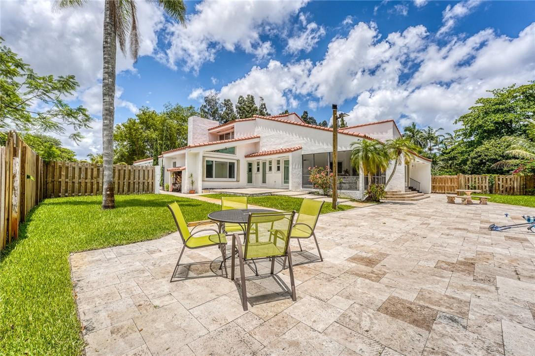 5901 Cypress Road Plantation, FL 33317 - Photo 77 of 99 a view of a house with a yard porch and sitting area