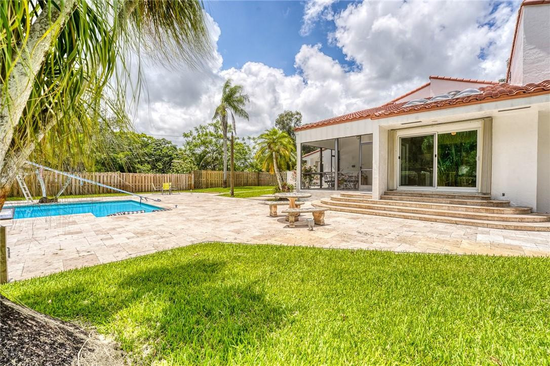 5901 Cypress Road Plantation, FL 33317 - Photo 86 of 99 a view of a house with a big yard and palm trees