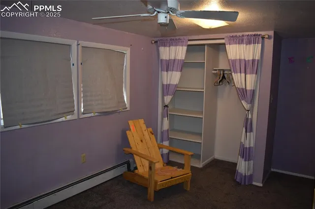 a room that has a bed and a chair in it