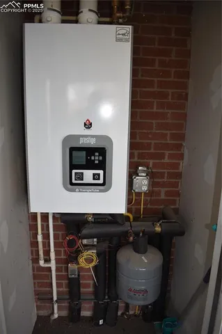 a living room with furniture and a lamp