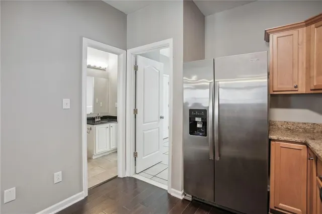 a refrigerator freezer sitting inside of a kitchen