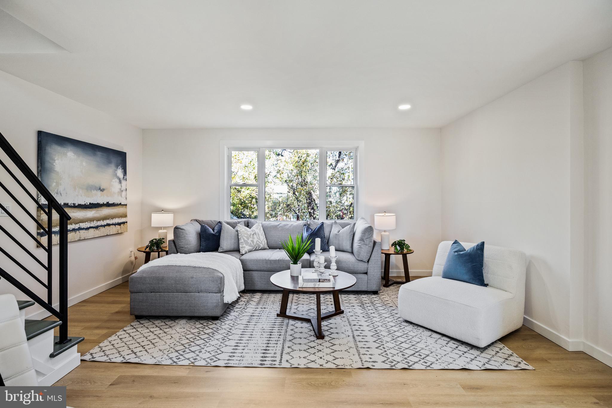 859 Selmer Road Philadelphia, PA 19116 - Photo 12 of 47 a living room with furniture and a large window