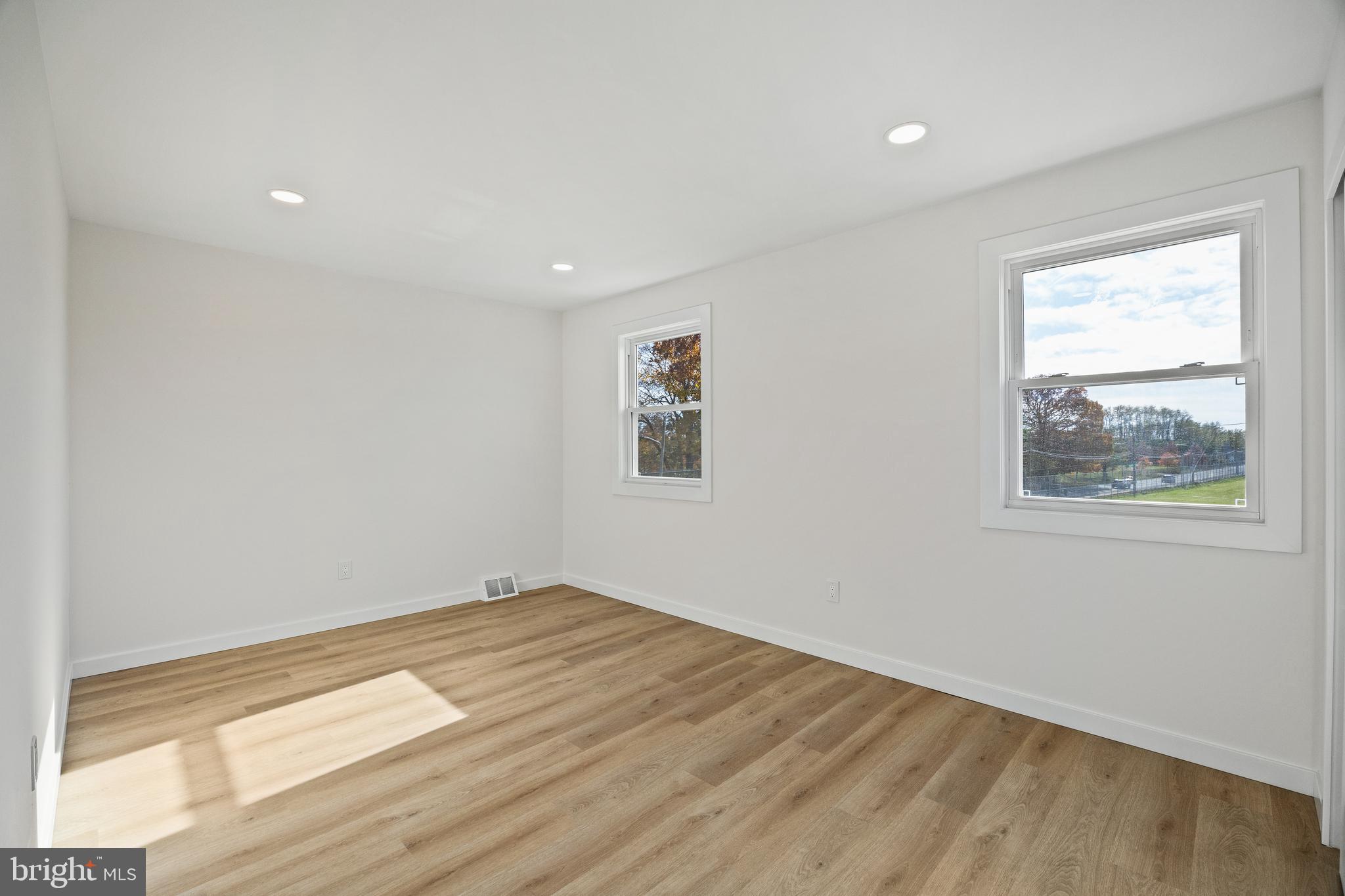 859 Selmer Road Philadelphia, PA 19116 - Photo 17 of 47 a view of empty room with wooden floor and fan