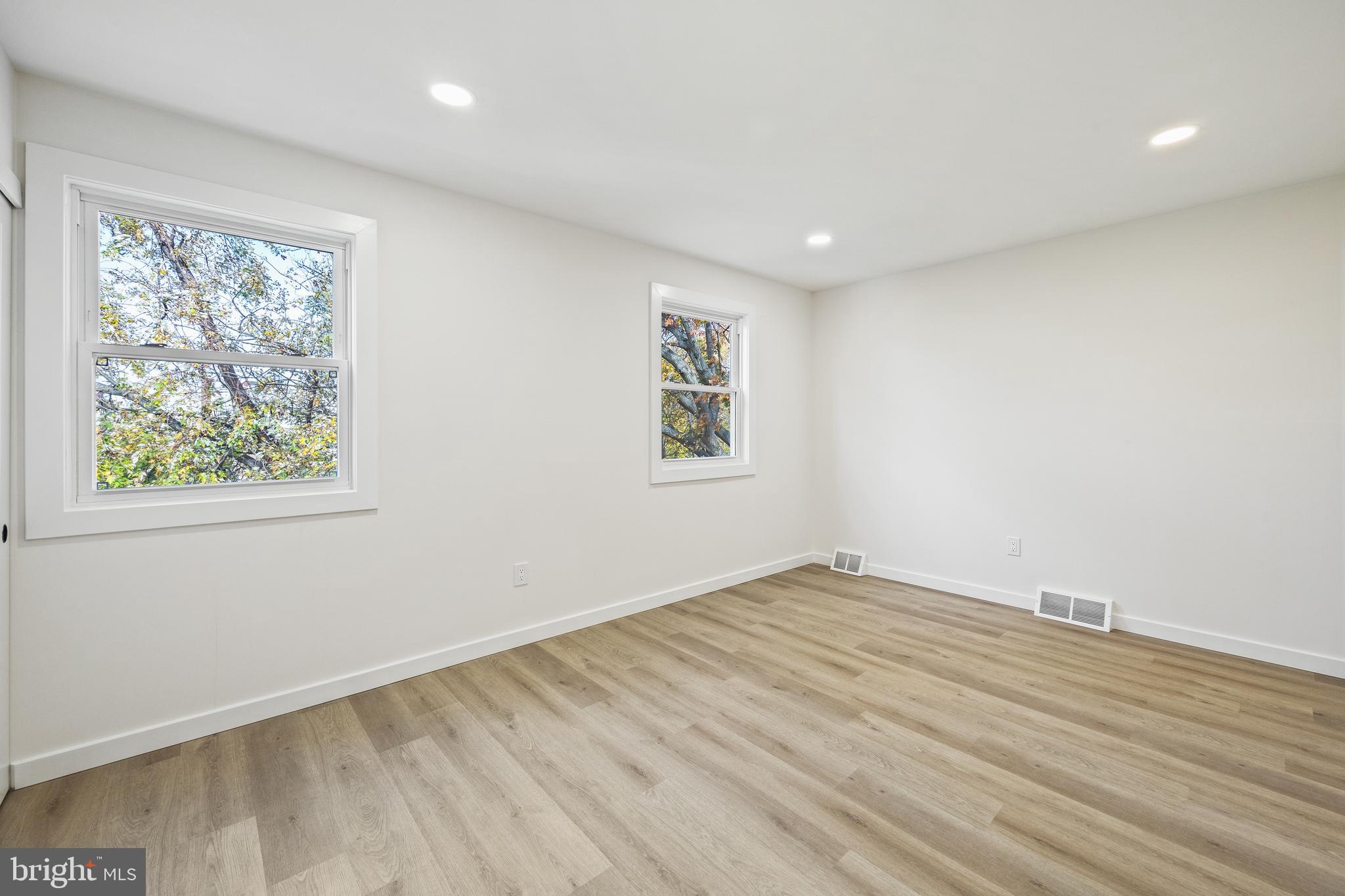 859 Selmer Road Philadelphia, PA 19116 - Photo 24 of 47 a view of empty room with wooden floor and fan