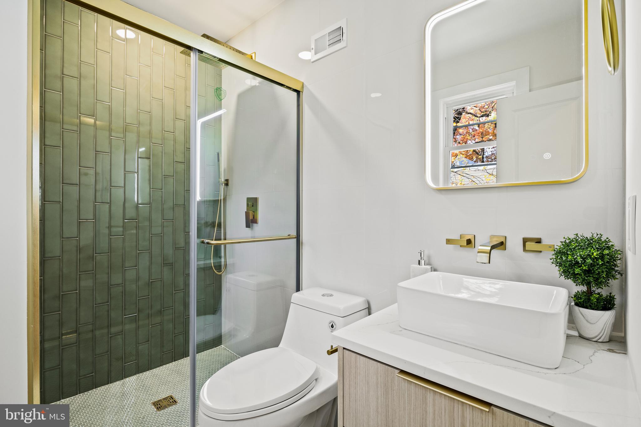 859 Selmer Road Philadelphia, PA 19116 - Photo 27 of 47 a bathroom with a sink a toilet and shower