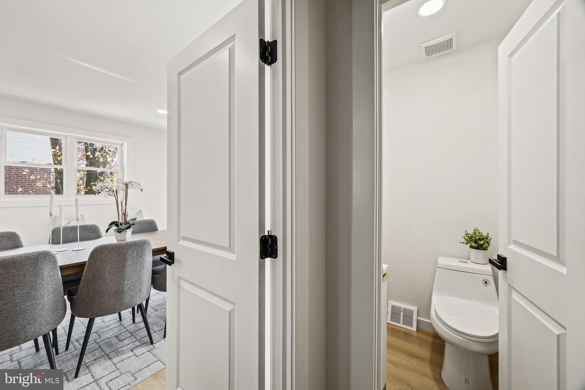 859 Selmer Road Philadelphia, PA 19116 - Photo 28 of 47 a view of bathroom with a toilet sink and mirror