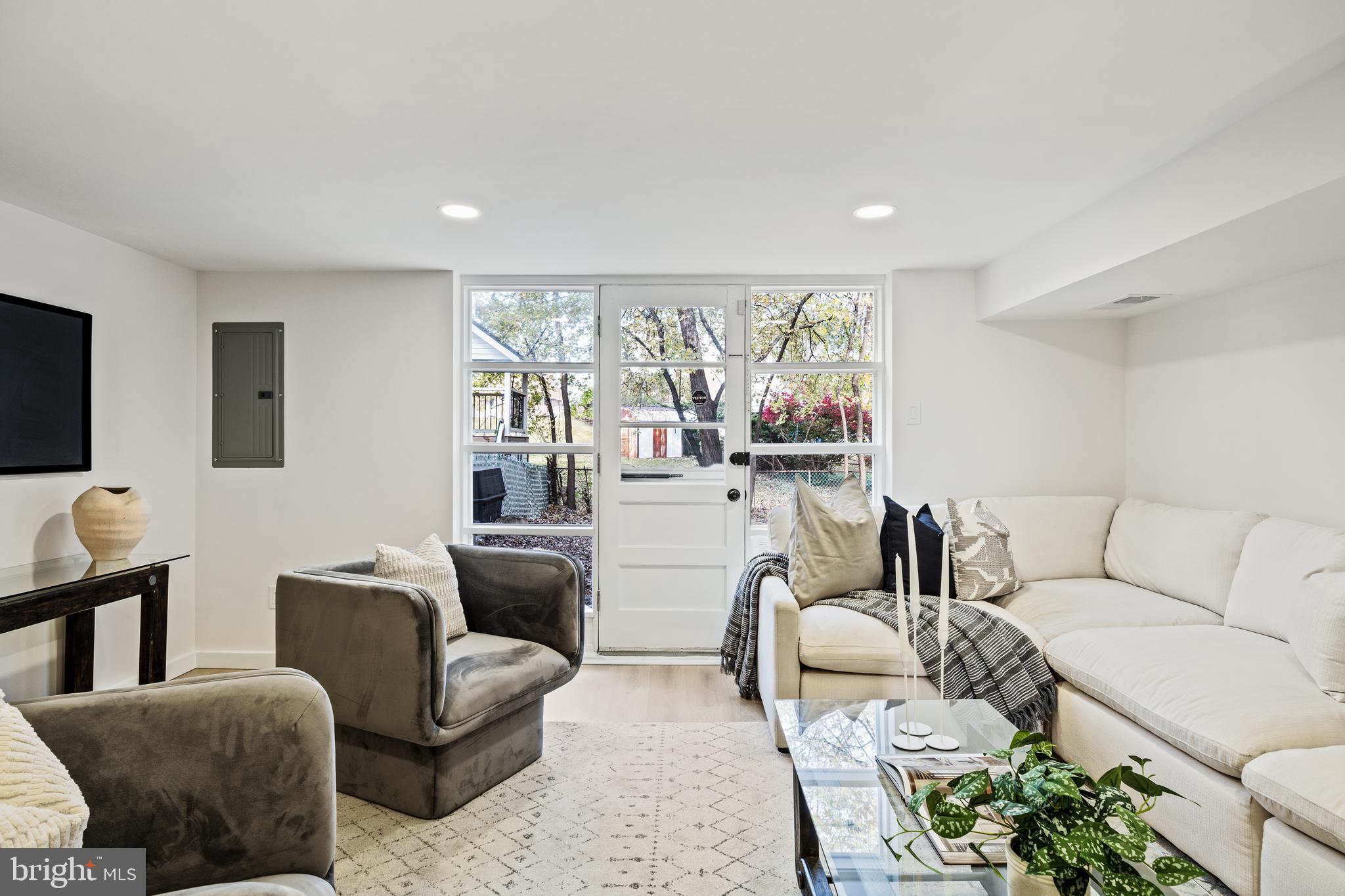 859 Selmer Road Philadelphia, PA 19116 - Photo 32 of 47 a living room with furniture and a flat screen tv