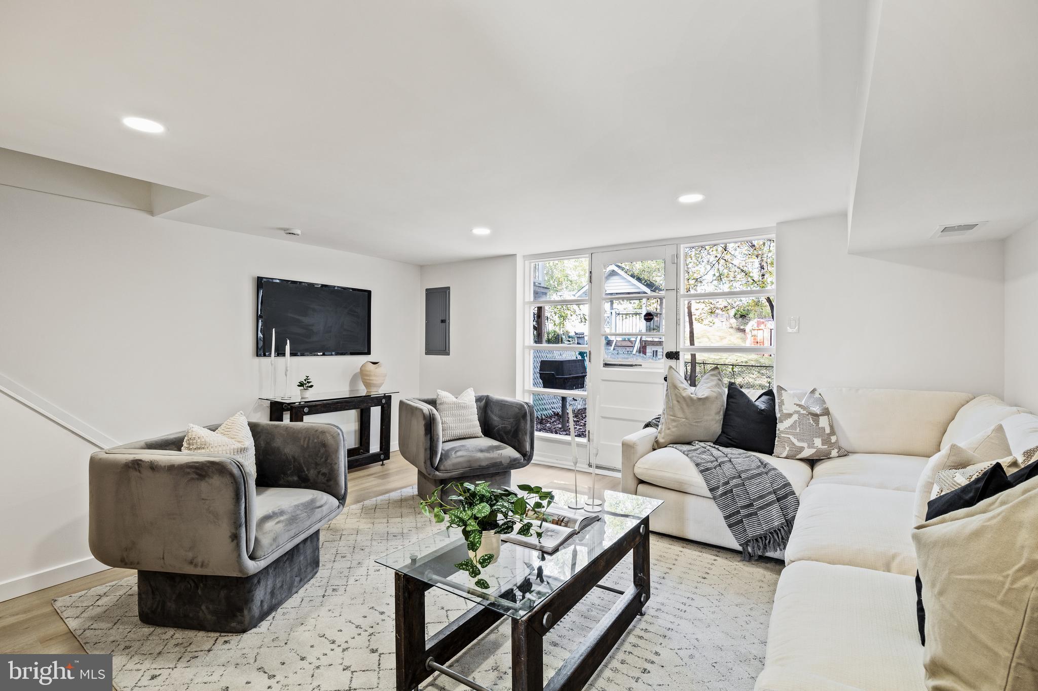 859 Selmer Road Philadelphia, PA 19116 - Photo 33 of 47 a living room with furniture and a flat screen tv