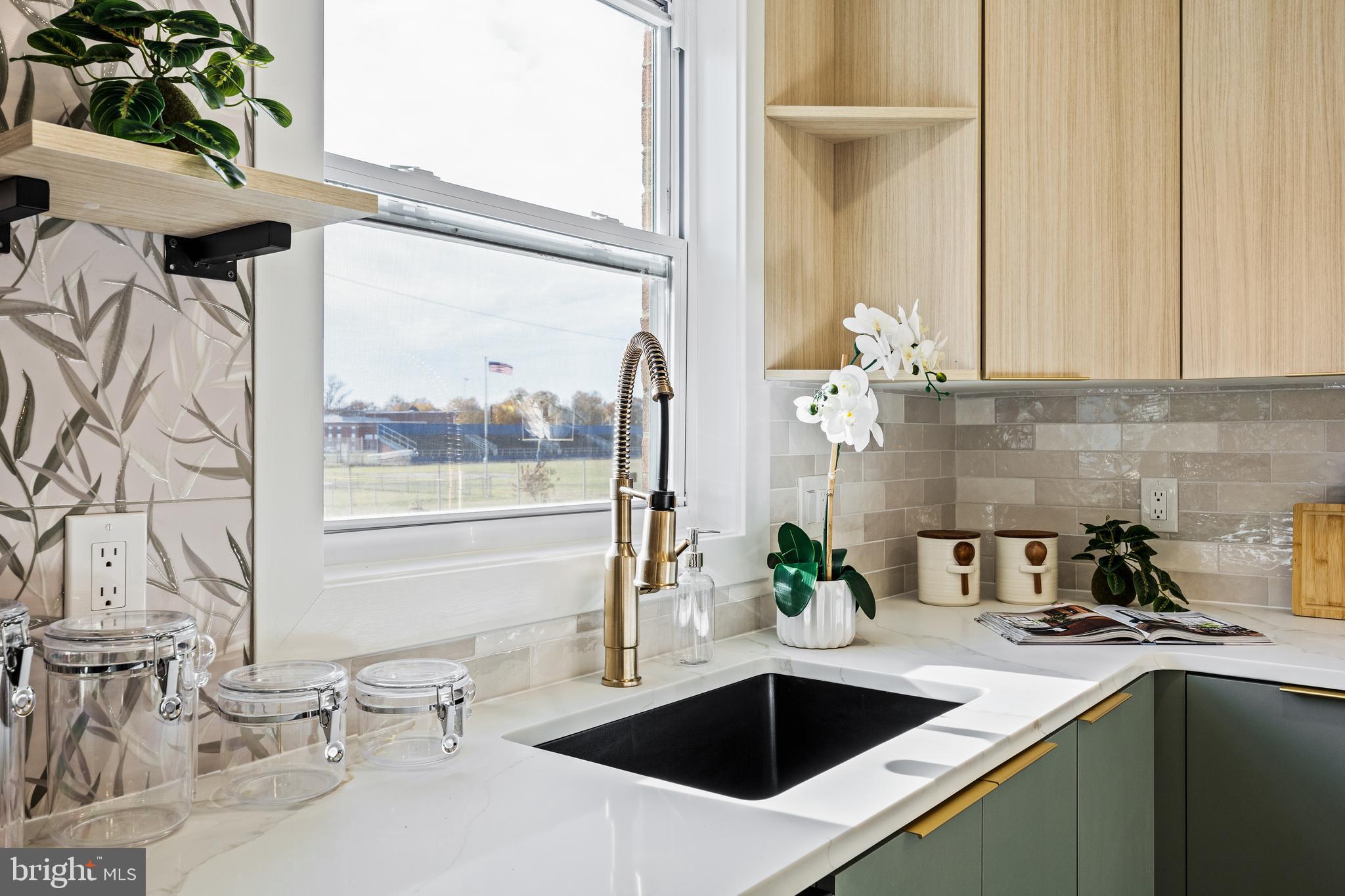859 Selmer Road Philadelphia, PA 19116 - Photo 6 of 47 a kitchen with a sink and large window