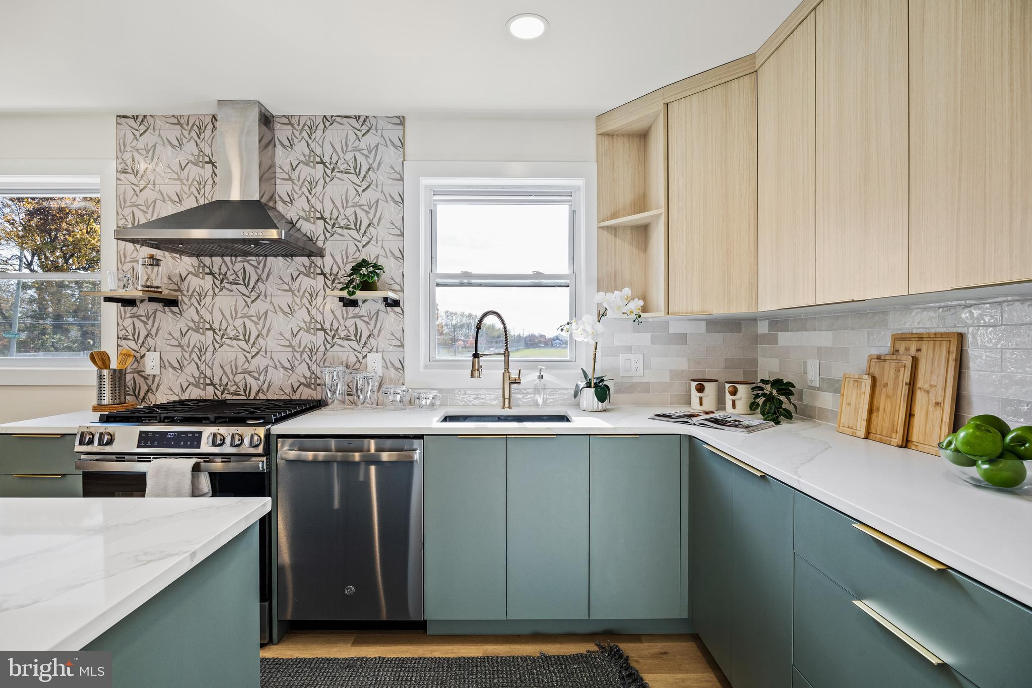 859 Selmer Road Philadelphia, PA 19116 - Photo 8 of 47 a kitchen with stainless steel appliances a sink stove and cabinets