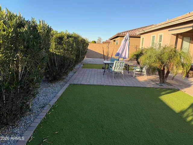 swimming pool with outdoor seating and garden