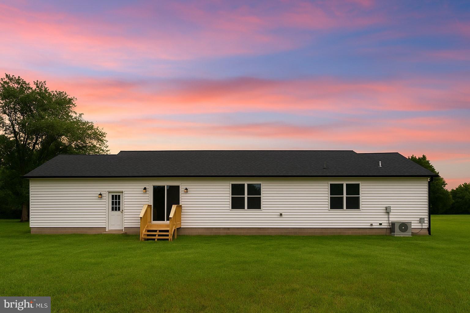3345 Gallagher Road Preston, MD 21655 - Photo 2 of 9 Charming home under a vibrant sunset sky.