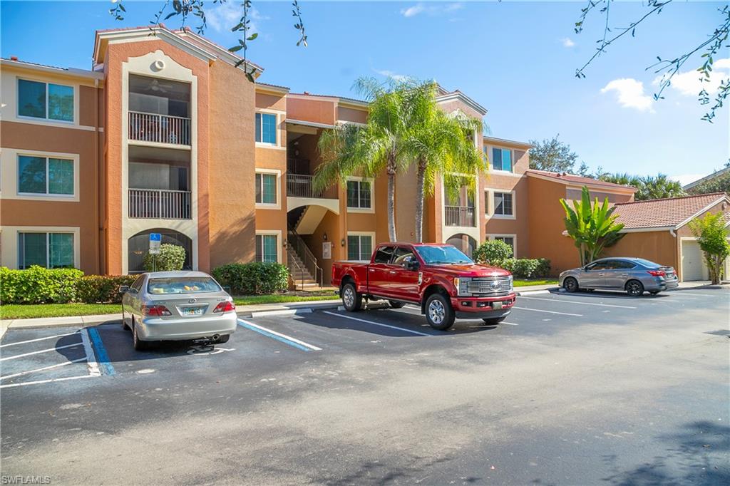 1160 Reserve Way, Unit 303 Naples, FL 34105 - Photo 15 of 19 a car parked in front of a house