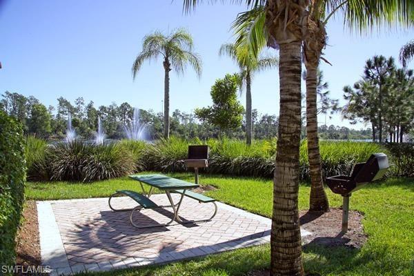 1160 Reserve Way, Unit 303 Naples, FL 34105 - Photo 16 of 19 a view of a backyard with a patio