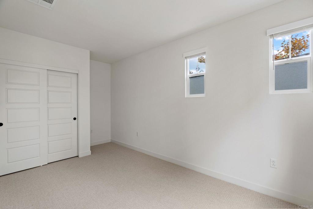 13018 Lumen Way San Diego, CA 92130 - Photo 29 of 45 an empty room with windows