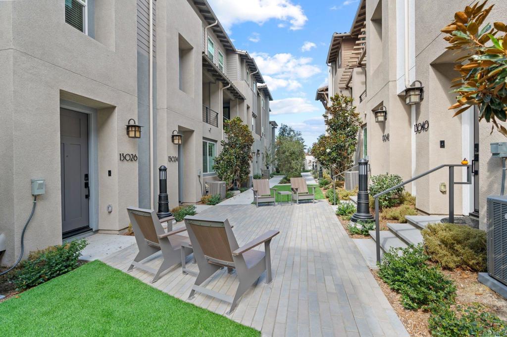 13018 Lumen Way San Diego, CA 92130 - Photo 4 of 45 a view of a patio with couches table and chairs and potted plants