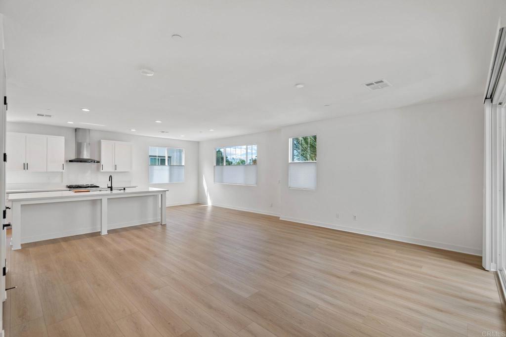 13018 Lumen Way San Diego, CA 92130 - Photo 8 of 45 a view of kitchen with wooden floor and electronic appliances