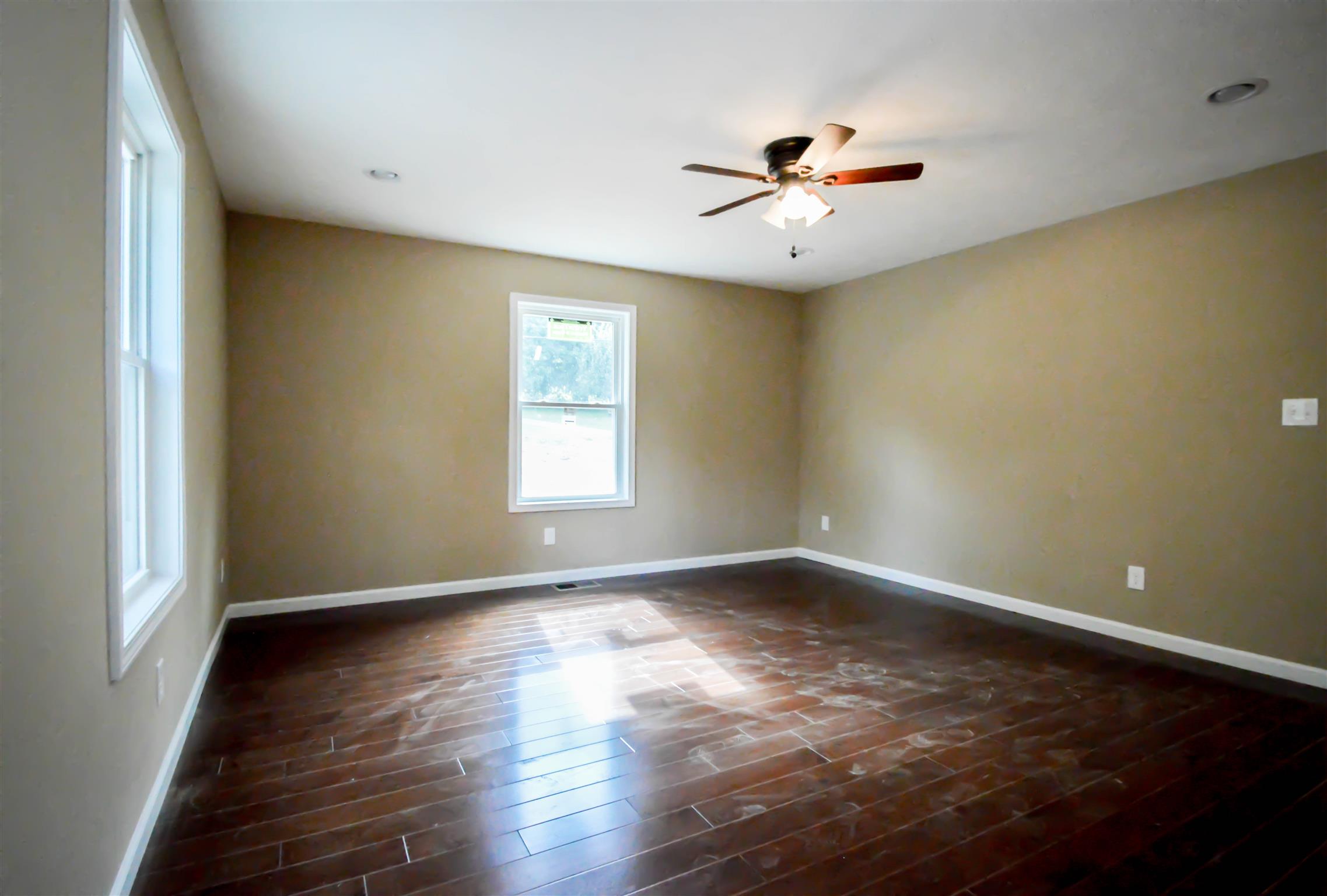30 Riddleton Circle Pleasant Shade, TN 37145 - Photo 14 of 18 a view of an empty room with wooden floor and a window