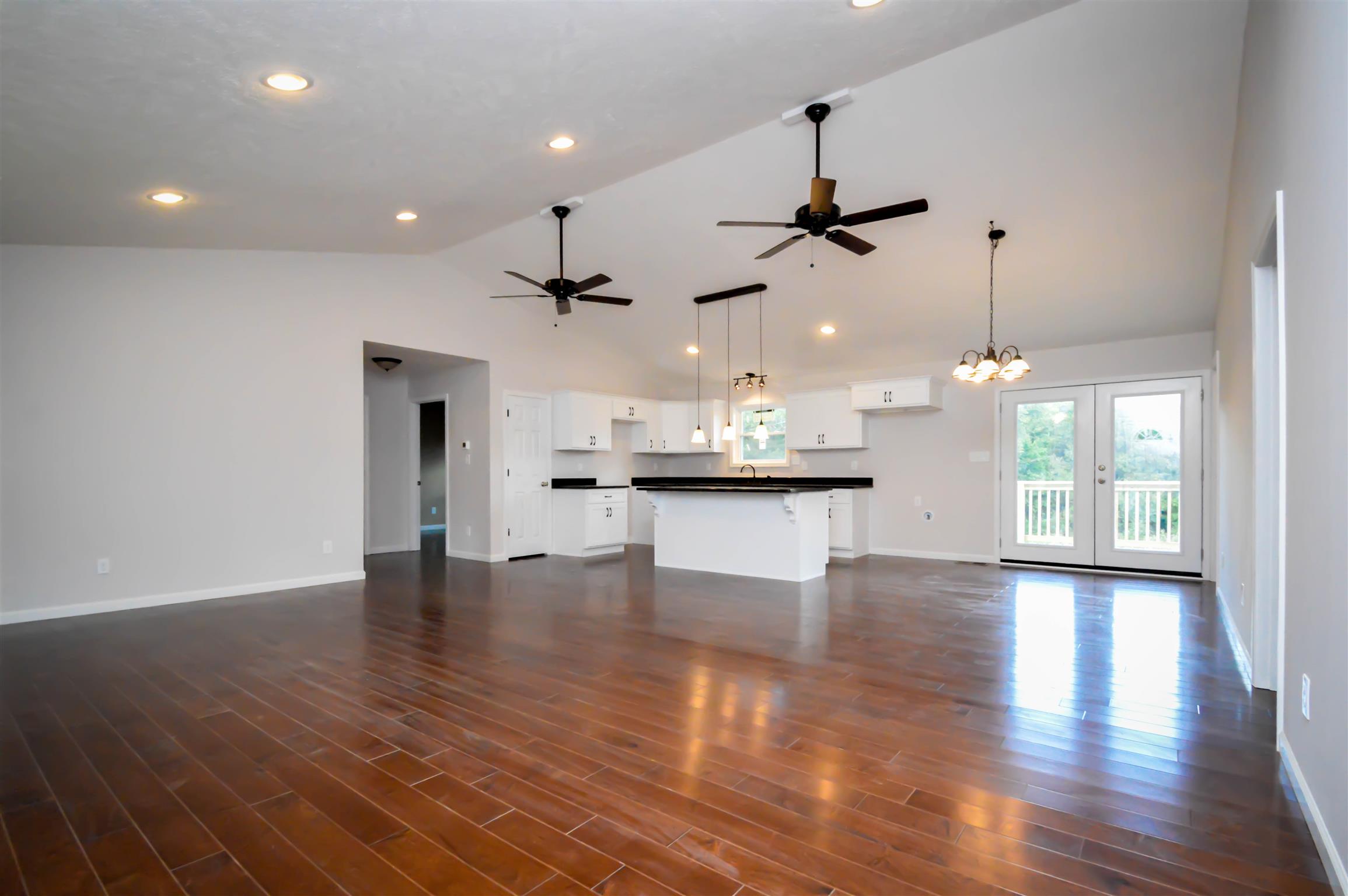 30 Riddleton Circle Pleasant Shade, TN 37145 - Photo 18 of 18 a view of an empty room with wooden floor and a ceiling fan