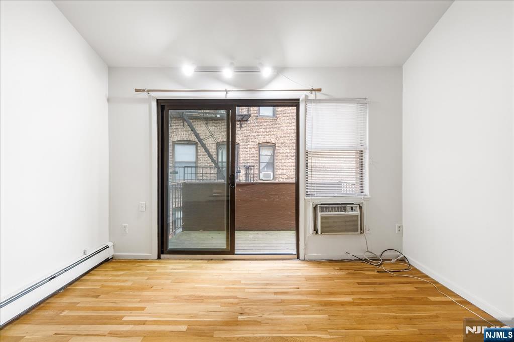 70 Orient Way, Unit 9 Rutherford, NJ 07070 - Photo 12 of 16 a view of an empty room with glass door