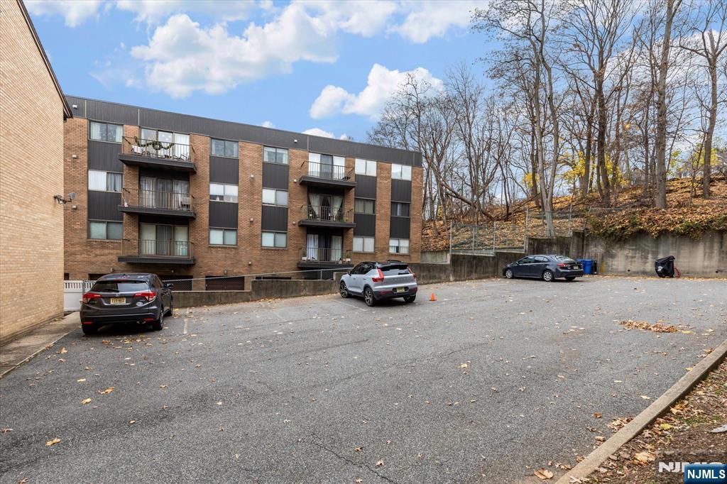 70 Orient Way, Unit 9 Rutherford, NJ 07070 - Photo 15 of 16 a car parked in front of a building