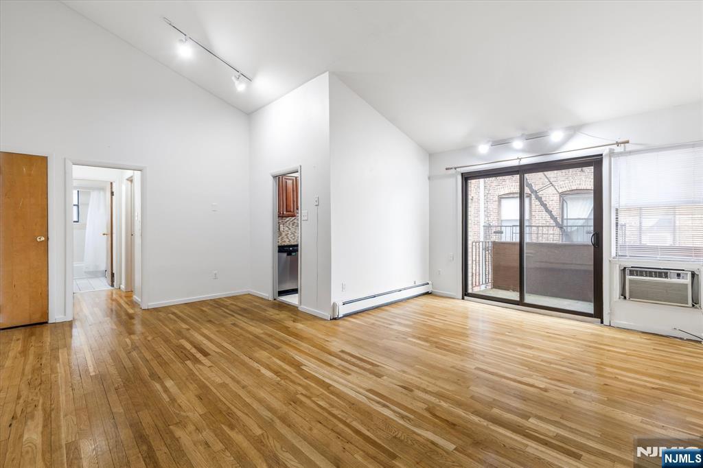 70 Orient Way, Unit 9 Rutherford, NJ 07070 - Photo 2 of 16 a view of empty room with wooden floor and fan