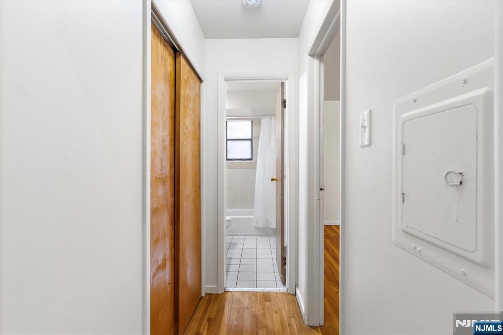 70 Orient Way, Unit 9 Rutherford, NJ 07070 - Photo 8 of 16 a view of a hallway with wooden floor and closet