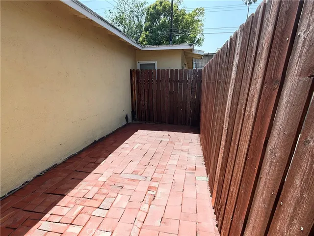 a view of wooden floor in a backyard