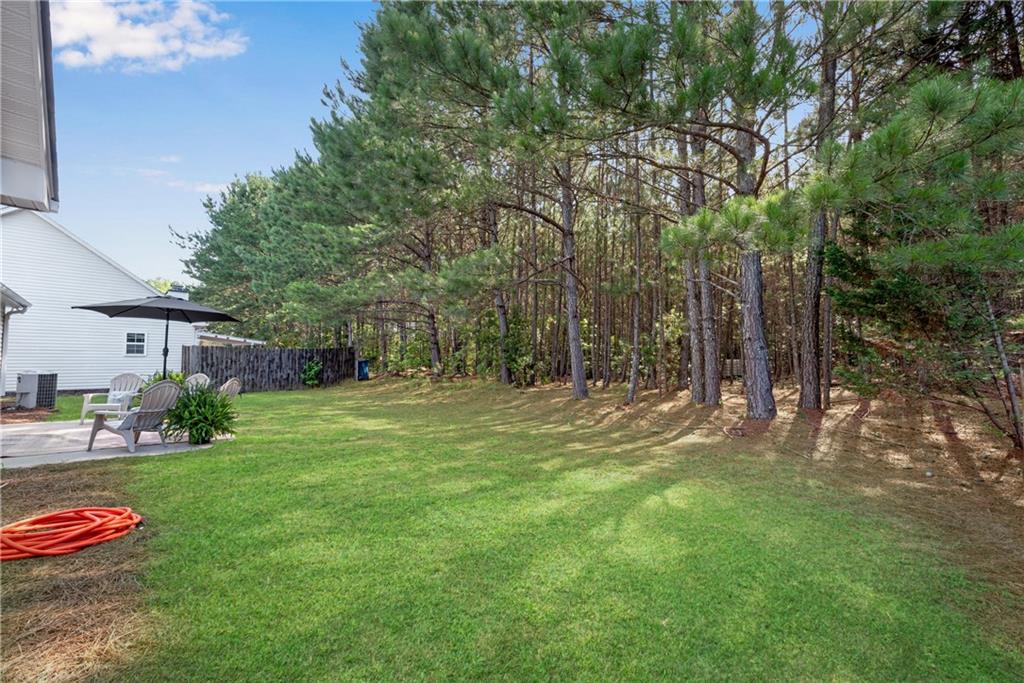 125 Pine Ridge Trace Athens, GA 30605 - Photo 24 of 28 a backyard of a house with table and chairs