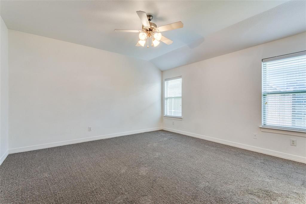 1513 Rosson Road Little Elm, TX 75068 - Photo 11 of 17 an empty room with windows and chandelier fan