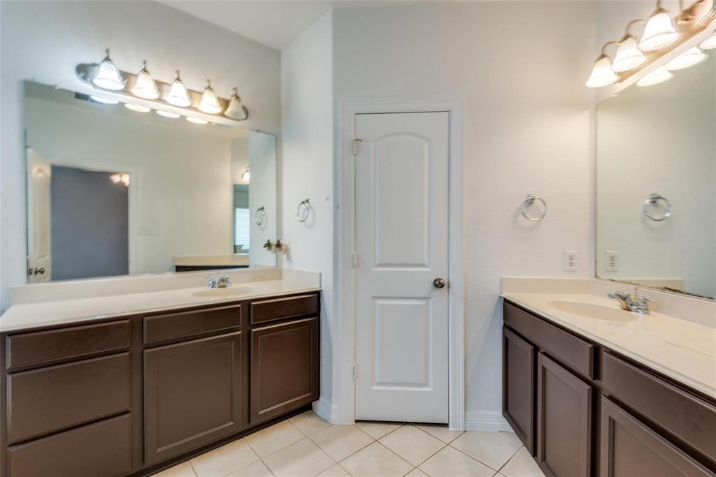 1513 Rosson Road Little Elm, TX 75068 - Photo 12 of 17 a view with double vanity sink a vanity and a mirror
