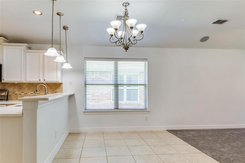 1513 Rosson Road Little Elm, TX 75068 - Photo 6 of 17 a view of a kitchen with a sink and chandelier