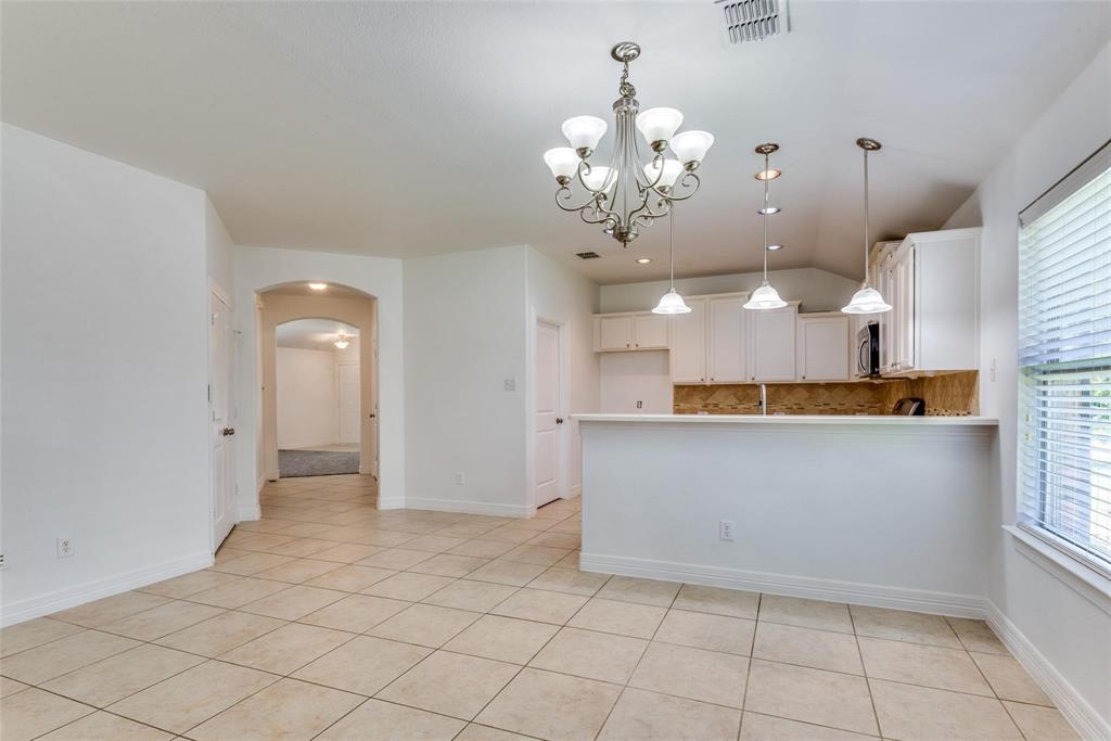 1513 Rosson Road Little Elm, TX 75068 - Photo 7 of 17 a view of a hallway with chandelier