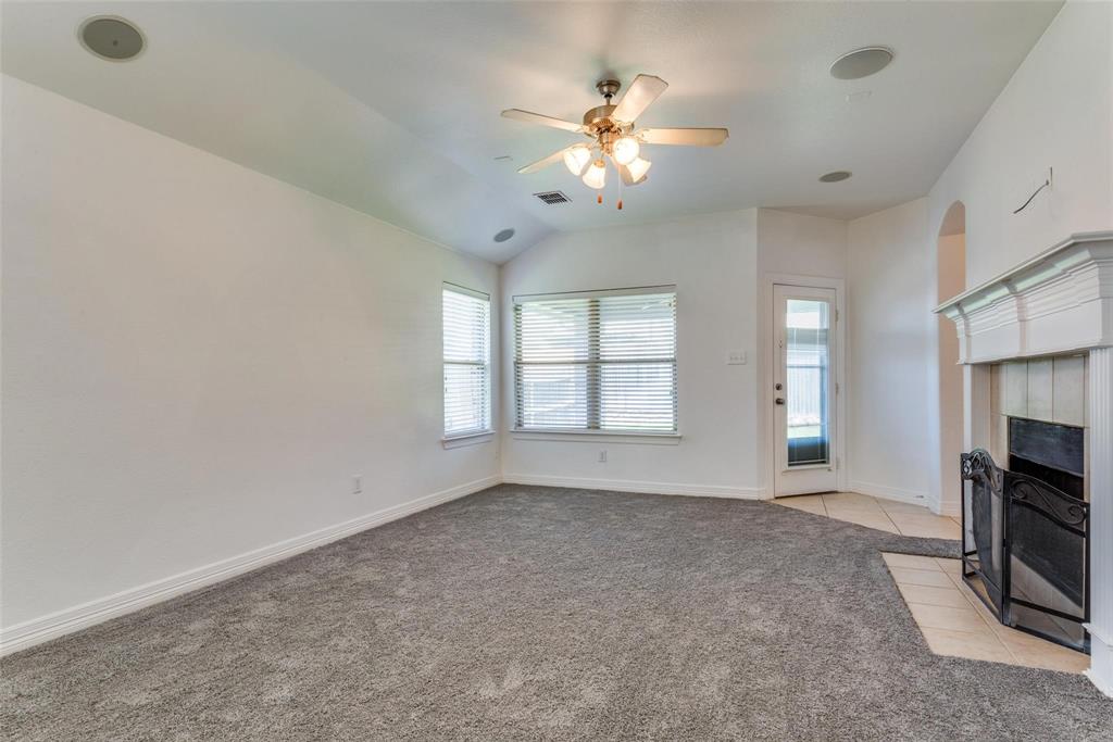 1513 Rosson Road Little Elm, TX 75068 - Photo 9 of 17 a view of an empty room with a fireplace