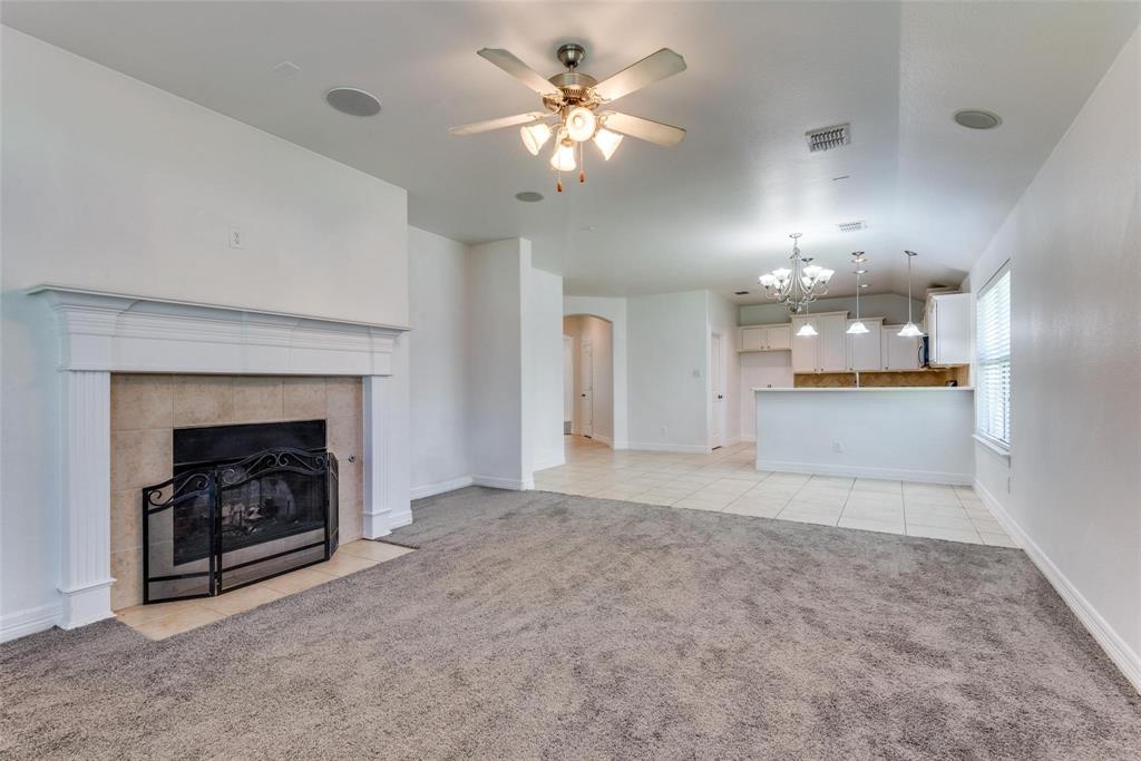 1513 Rosson Road Little Elm, TX 75068 - Photo 10 of 17 a view of an empty room with a fireplace