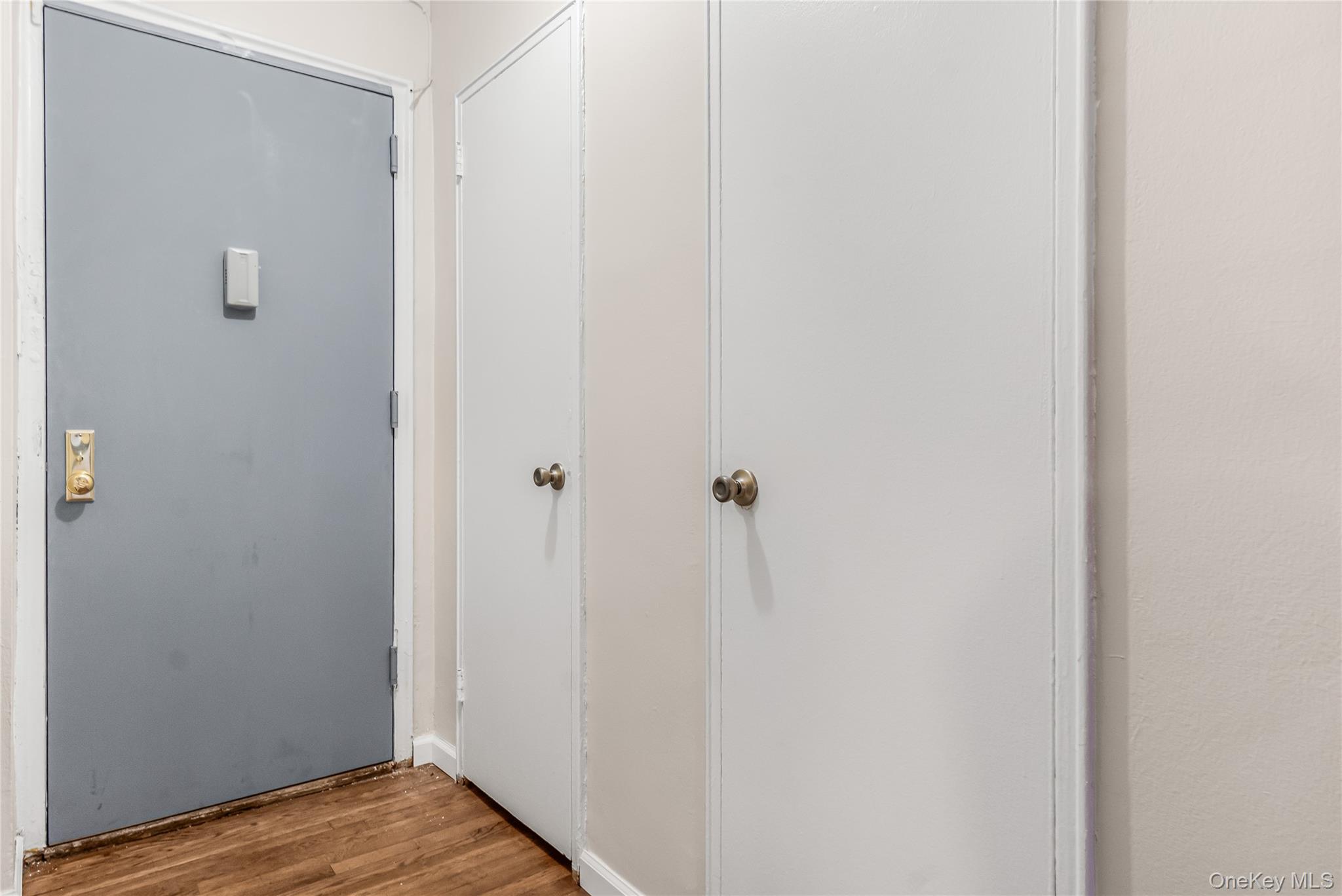 84-50 169th Street, Unit 418 Queens, NY 11432 - Photo 3 of 15 Hall featuring wood finished floors