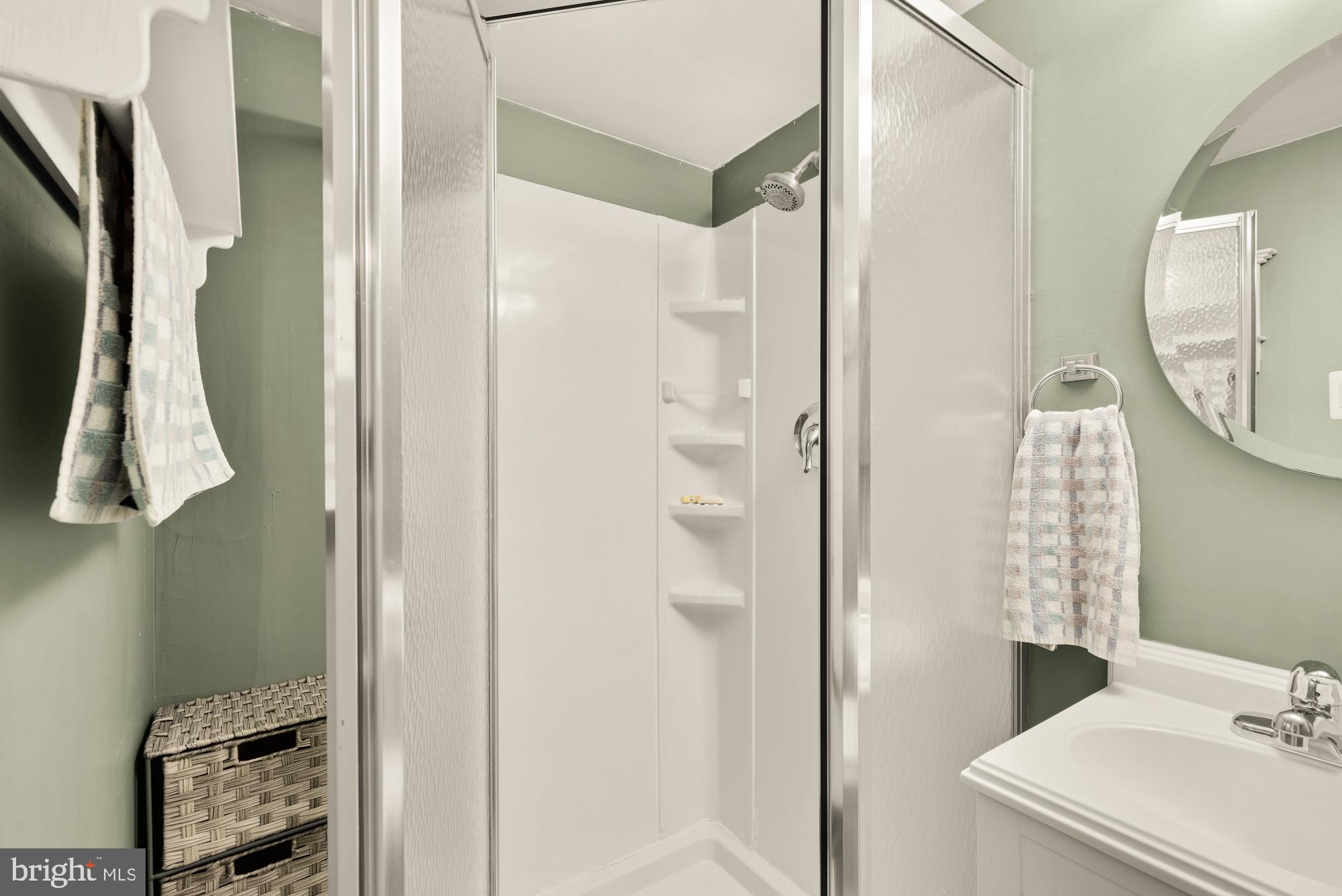 8100 Loving Forest Court Springfield, VA 22153 - Photo 28 of 33 a bathroom with a sink and a mirror
