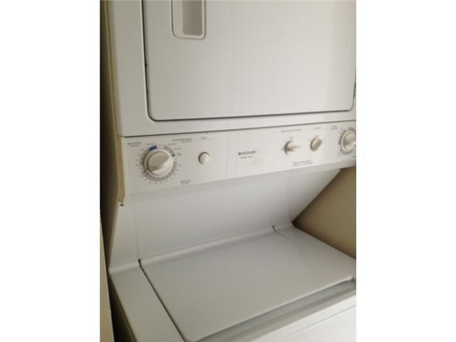 4164 Inverrary Drive, Unit 806 Lauderhill, FL 33319 - Photo 16 of 23 a close up view of a utility room with dryer and washer