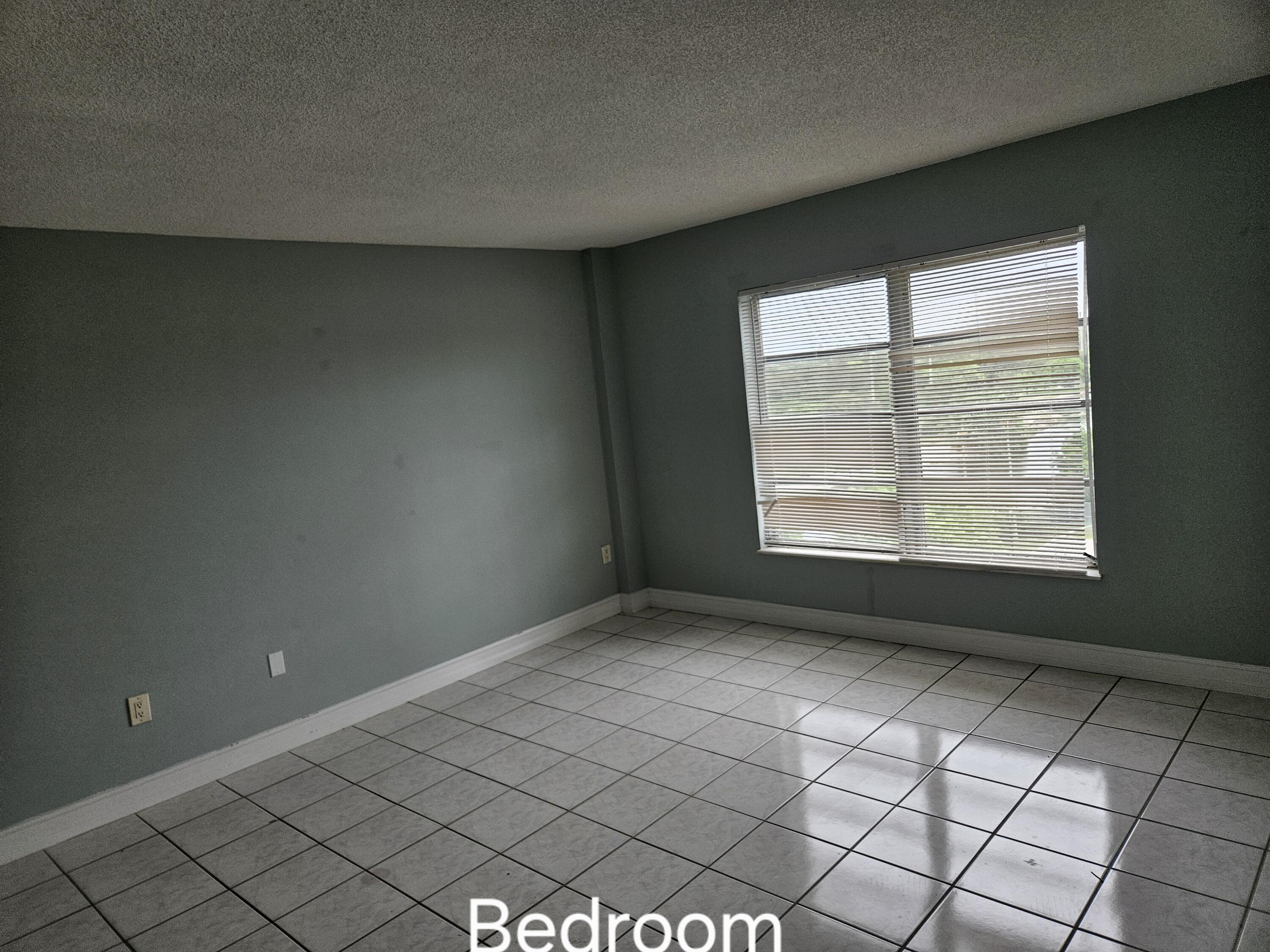 4164 Inverrary Drive, Unit 806 Lauderhill, FL 33319 - Photo 20 of 23 a view of an empty room and window