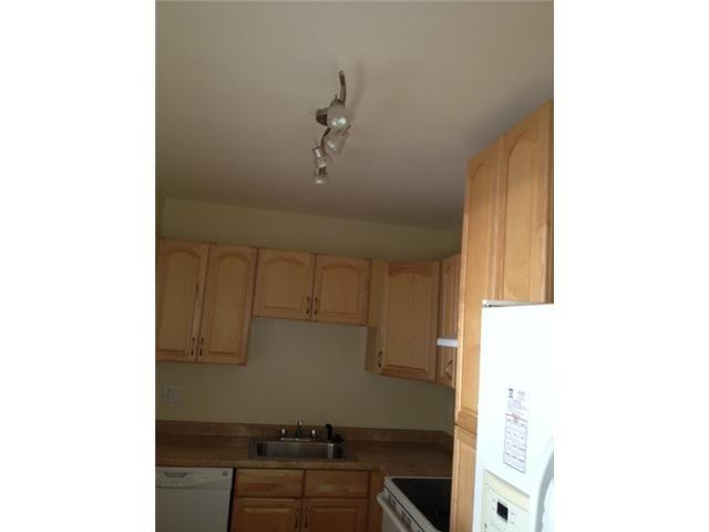 4164 Inverrary Drive, Unit 806 Lauderhill, FL 33319 - Photo 10 of 23 a kitchen with a sink and cabinets