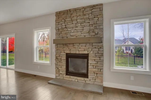 a spacious bathroom with a toilet sink and mirror