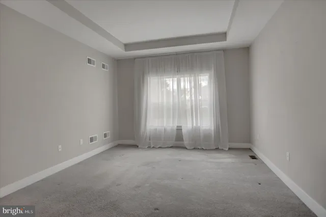 a white bath tub sitting in a bathroom and shower