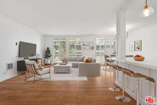 a living room with fireplace furniture and a flat screen tv