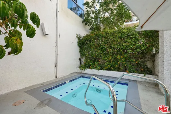 a view of a balcony with plants